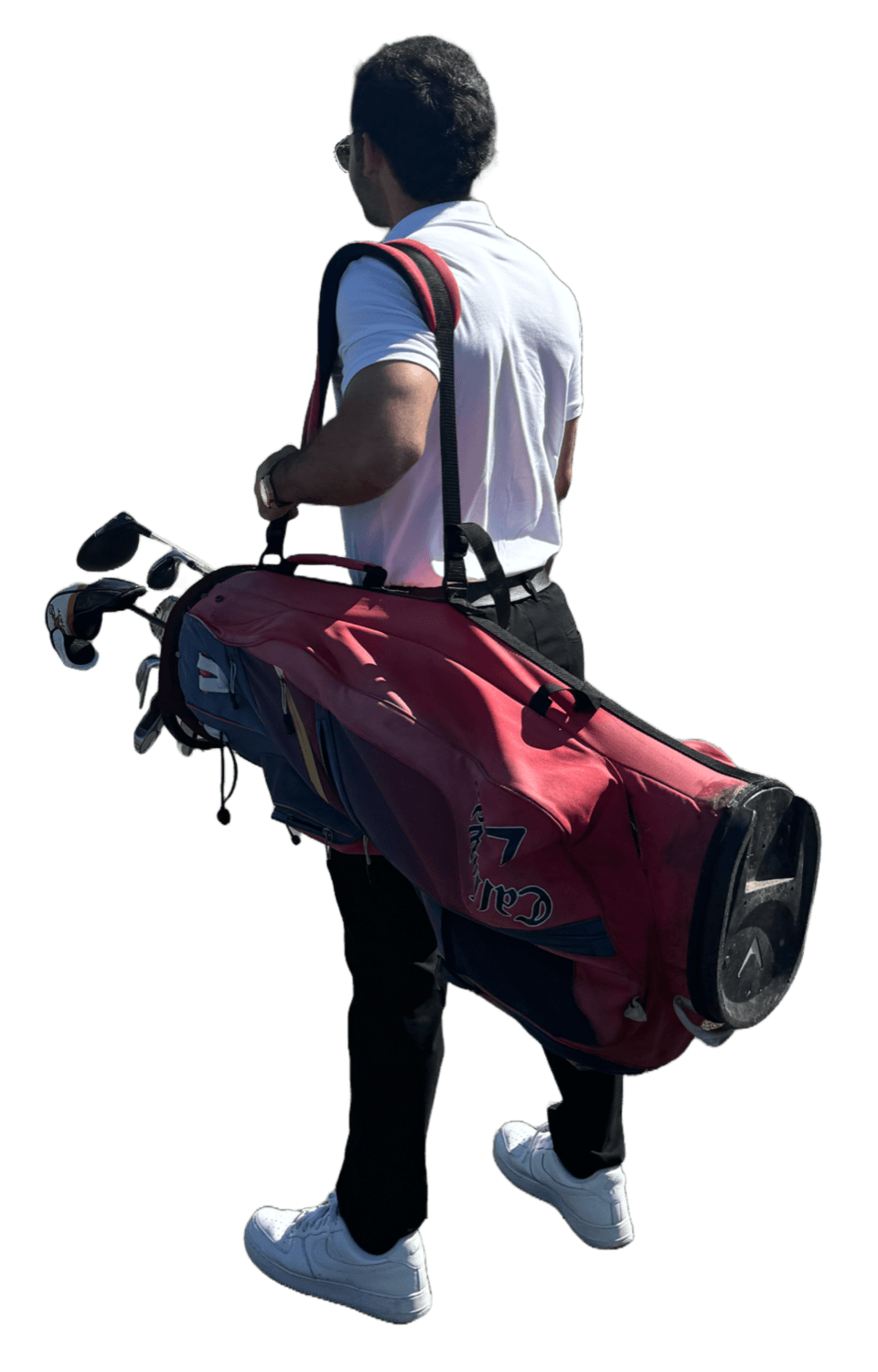Mohammad standing with a golf bag